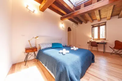 Letto o letti in una camera di GuestHost - Vakalu Piazza Duomo Charming Apartment