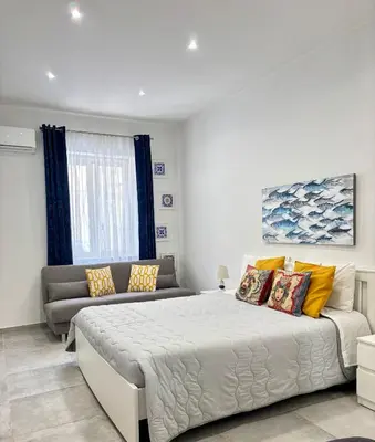 Letto o letti in una camera di Casa mia bella