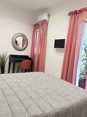 Letto o letti in una camera di Casa mia bella