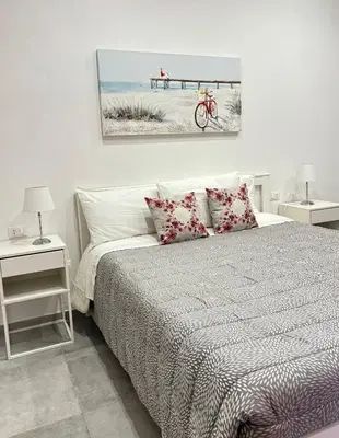 Letto o letti in una camera di Casa mia bella