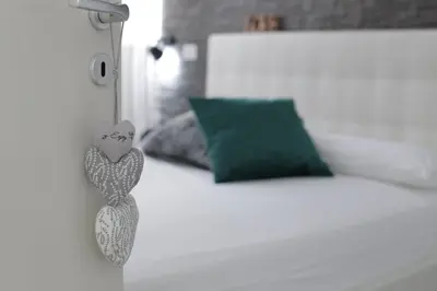 Letto o letti in una camera di Al Cortile del Re Luxury Home