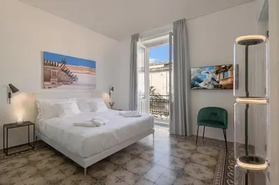 Letto o letti in una camera di Sikelia Suites