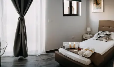 Letto o letti in una camera di B&B Stramondo