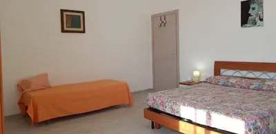 Letto o letti in una camera di Il Terrazzo di Apollo