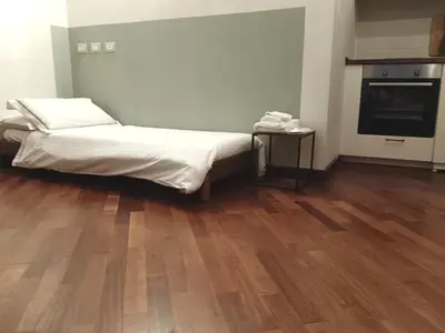 Letto o letti in una camera di Casa Bellomo Ortigia