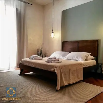 Letto o letti in una camera di Casa Bellomo Ortigia