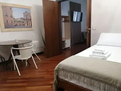 Letto o letti in una camera di Casa Bellomo Ortigia