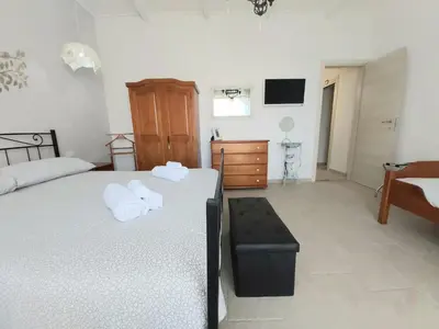 Letto o letti in una camera di Amononna