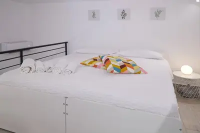 Letto o letti in una camera di La Palma Loft Located in the Heart of Catania
