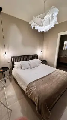 Letto o letti in una camera di Casa Adriana