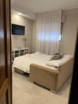 Letto o letti in una camera di Casa Adriana