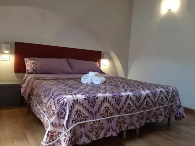 Letto o letti in una camera di Sabbia del Sud Affittacamere