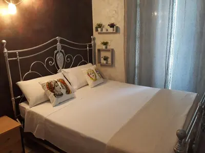 Letto o letti in una camera di B&B Sotto gli archi