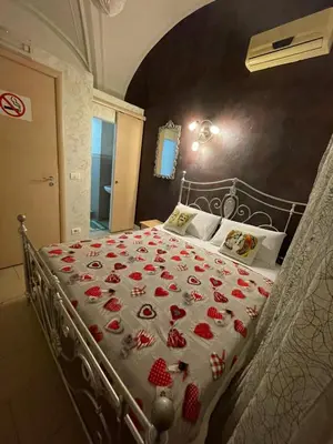 Letto o letti in una camera di B&B Sotto gli archi
