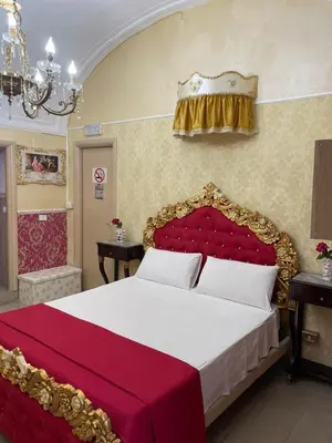 Letto o letti in una camera di B&B Sotto gli archi