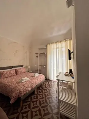 Letto o letti in una camera di Il Teatro Rooms