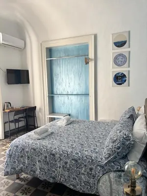 Letto o letti in una camera di Il Teatro Rooms
