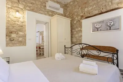Letto o letti in una camera di Salomone Apartments I by Wonderful Italy
