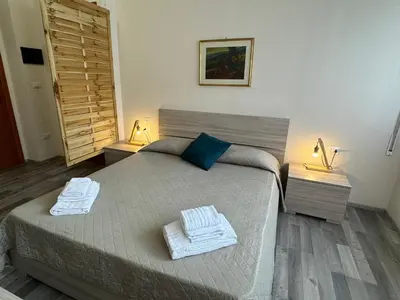 Letto o letti in una camera di R&B Santa Nicolella