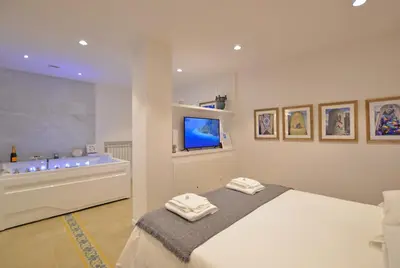 Letto o letti in una camera di 7 BLU Casa vacanze con idromassaggio