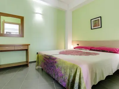 Letto o letti in una camera di Seaside Apartment with BBQ & Garden