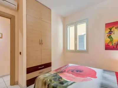 Letto o letti in una camera di Flat near the sea with air conditioning and patio