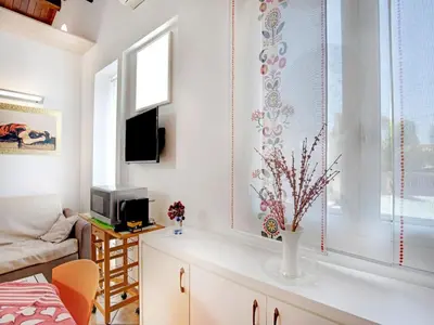 TV o dispositivi per l'intrattenimento presso Beachside Getaway w Garden