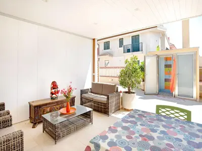 Area soggiorno di Beachside Getaway w Garden
