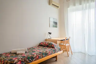 Letto o letti in una camera di GuestHost - Archaeological Park Apartment