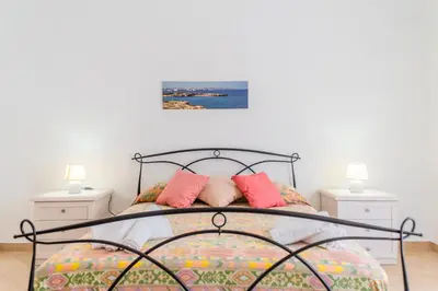 Letto o letti in una camera di GuestHost - Archaeological Park Apartment