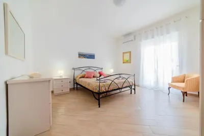Letto o letti in una camera di GuestHost - Archaeological Park Apartment