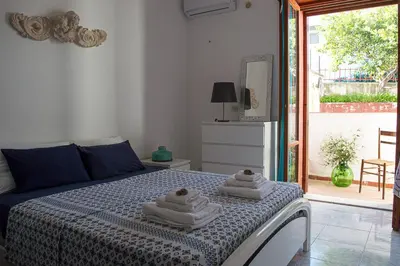 Letto o letti in una camera di Calypso Appartamento