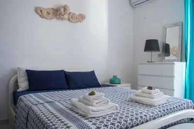 Letto o letti in una camera di Calypso Appartamento