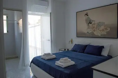 Letto o letti in una camera di Calypso Appartamento