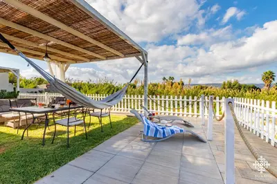 Giardino di Beach Front Villas