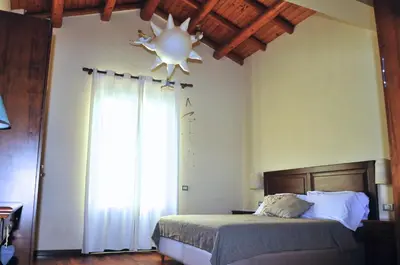 Letto o letti in una camera di Terrazza sul Castello Ursino by Wonderful Italy