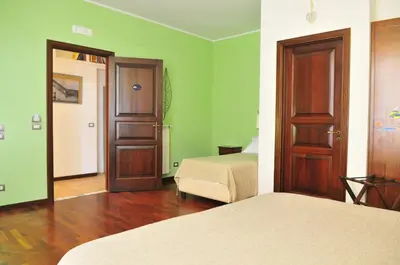Letto o letti in una camera di Terrazza sul Castello Ursino by Wonderful Italy