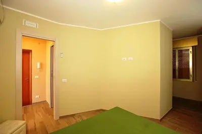 Letto o letti in una camera di RE SOLE CASE VACANZE - Esclusivo Attico M A R T E con spaziosissima terrazza solarium attrezzata
