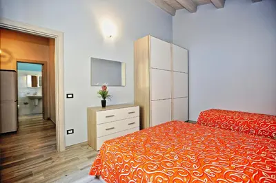 Letto o letti in una camera di RE SOLE La Dependance - Casa vacanza V E N E R E