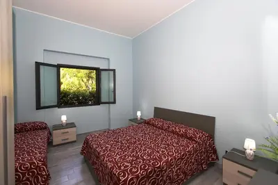 Letto o letti in una camera di RE SOLE La Dependance - Casa vacanza M E R C U R I O