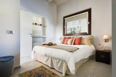 Letto o letti in una camera di Villa Scarlet con piscina privata