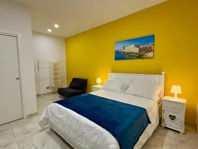 Letto o letti in una camera di Paolanna Rooms Affittacamere