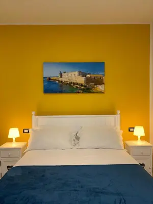 Letto o letti in una camera di Paolanna Rooms Affittacamere