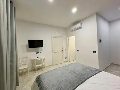 Letto o letti in una camera di Paolanna Rooms Affittacamere