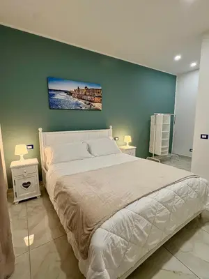 Letto o letti in una camera di Paolanna Rooms Affittacamere