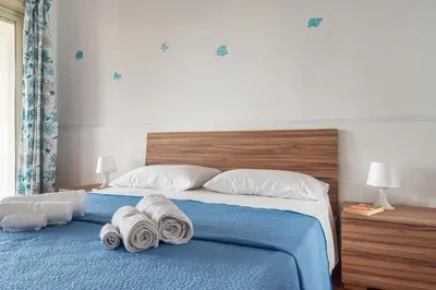 Letto o letti in una camera di VILLA LA VISTA - BAIA DEL GAMBERO