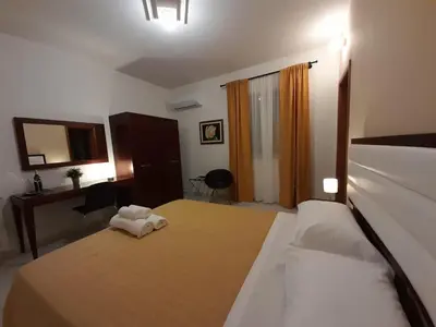 Letto o letti in una camera di Siracusa breakfast & rooms