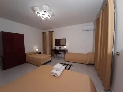 Letto o letti in una camera di Siracusa breakfast & rooms