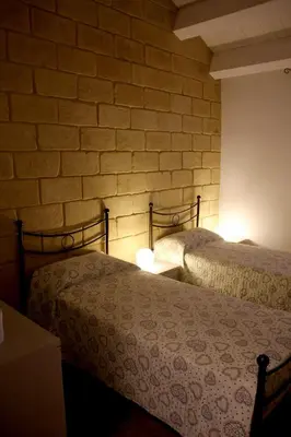 Letto o letti in una camera di Casa vacanze Vendicari
