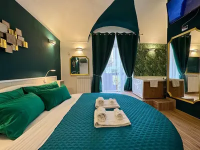 Letto o letti in una camera di CANTU' SUITE